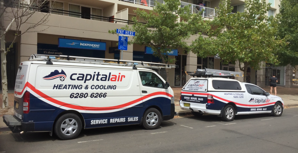 Air con installation van in front of building